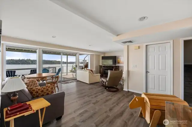 Moving to the lower level, this is the Family Room ... with a view... and access to the lower NEW deck.