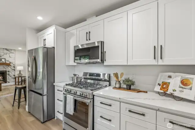 All-new stainless steel appliances, featuring a gas stove for the perfect cooking experience.