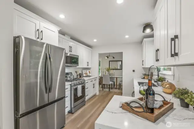 Soft-close cabinets paired with sleek, modern hardware and fixtures.