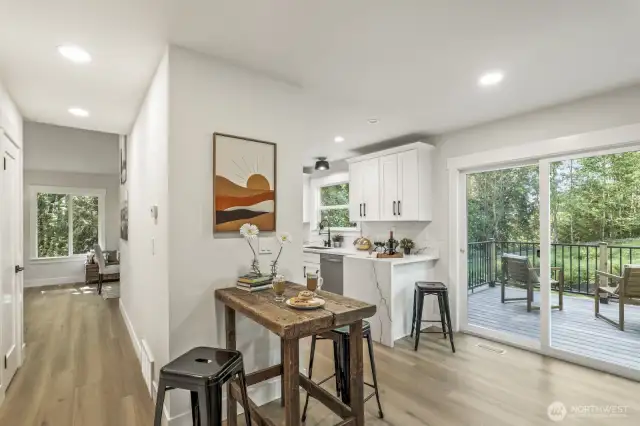 The family room connects seamlessly to the kitchen, with an oversized new Trex deck just off the family room—perfect for indoor-outdoor living.