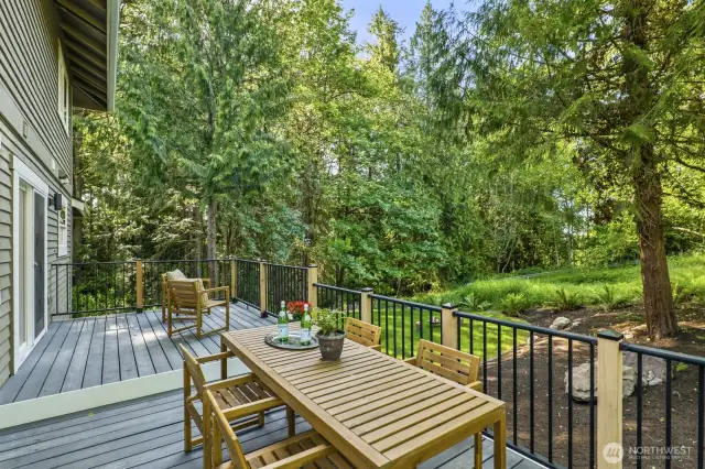 Enjoy beautiful views from the back deck overlooking a lush, green greenbelt for added privacy and serenity.
