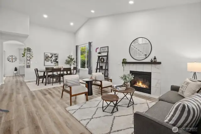 Formal Living and Dining Rooms with cozy fireplace, vaulted ceilings and added recessed lighting.
