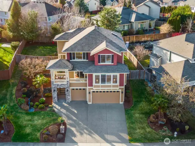 Wonderful curb appeal with fully fenced and manicured yard spacious enough to garden and play!
