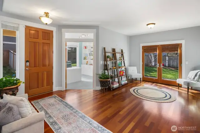 Executive style office tucked behind french doors off of the entry.