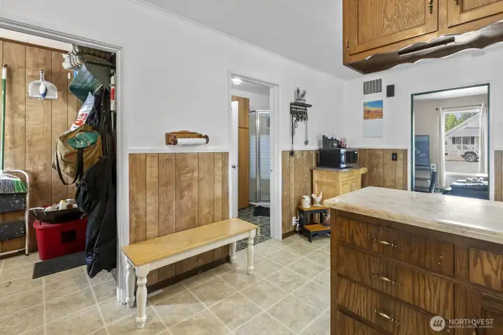 To the left is a pleasant, welcoming mud room.