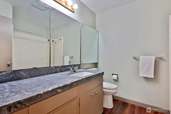 Full Guest Bath off of hallway between Entry and Kitchen.