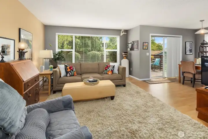 Another view of the light filled living room and the slider to the patio