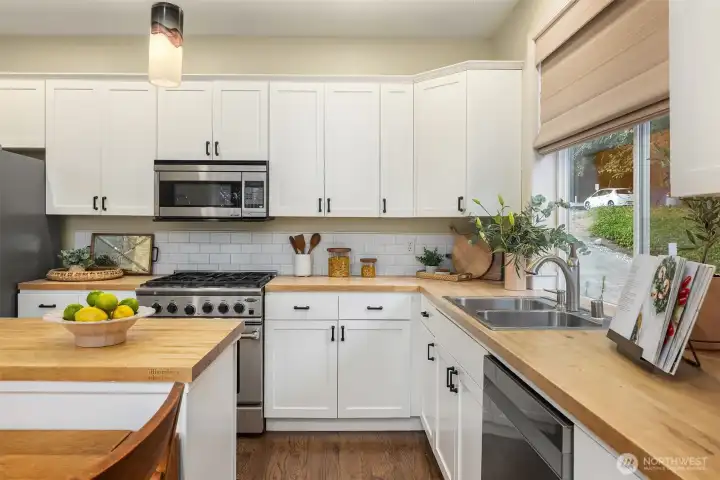 Lots of storage afford functional practicality in this well-equipped kitchen. Don't miss the slide out shelving.