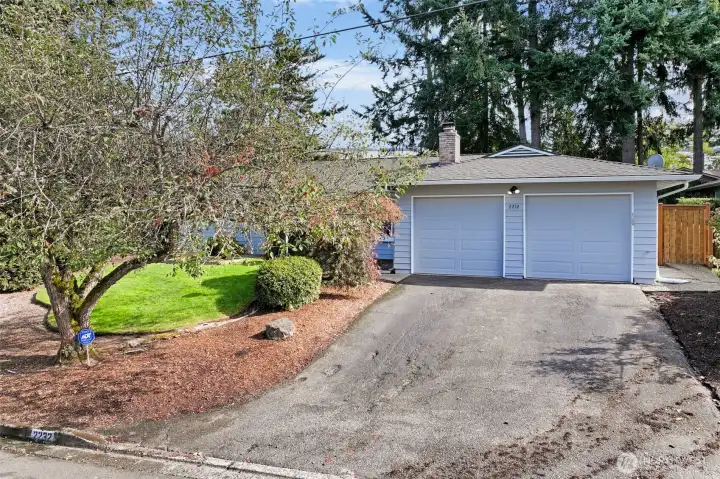 The home includes a spacious two-car garage and driveway, providing ample parking and storage options. Its position on a quiet residential street enhances the sense of privacy and comfort.