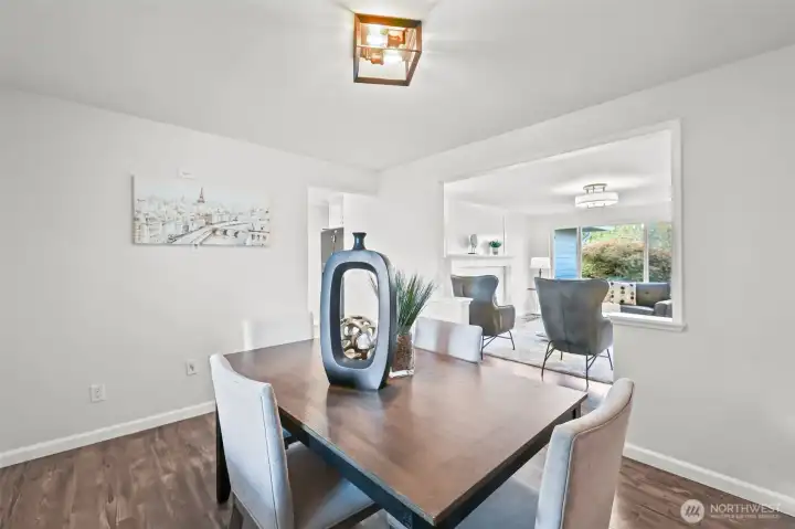 Another view of the dining space highlights its connection to the main living room, making it easy to host meals while remaining part of the conversation.
