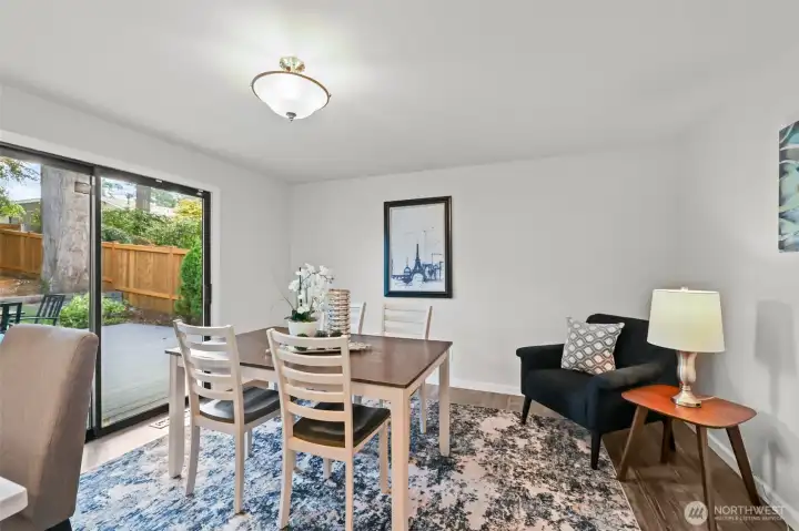 A flexible space adjacent to the kitchen offers backyard views and sliding glass doors to the deck. Whether used as a dining nook or a casual family room, it adapts easily to your lifestyle.