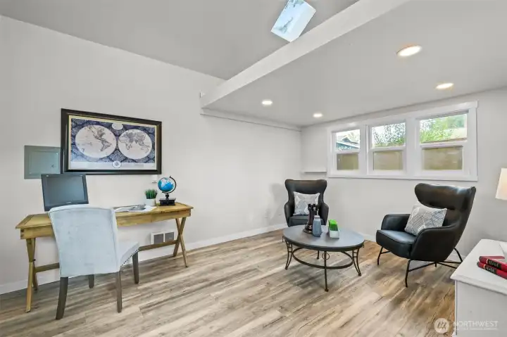 The home includes a versatile detached bonus area, ideal for an office, studio, or media area. With vaulted ceilings, skylight, and bright windows, it offers plenty of usable space for work or relaxation.