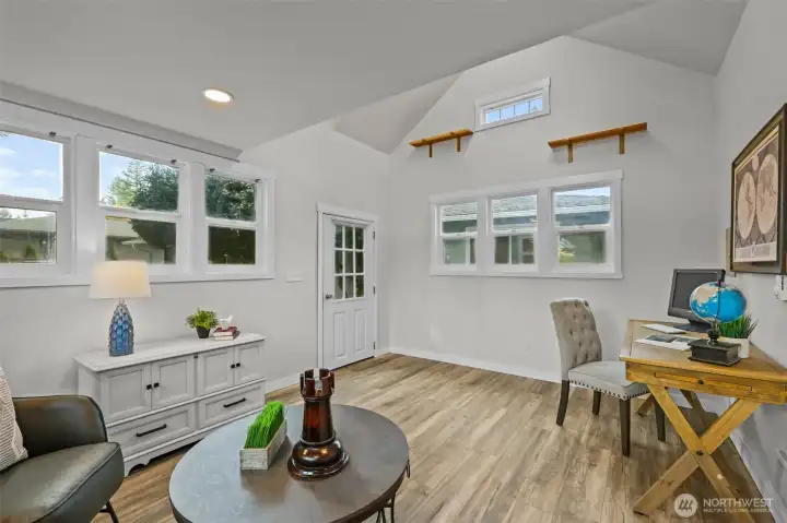 The detached bonus space features vaulted ceilings, multiple windows, and private entry — ideal as a home office, studio, or flex room.