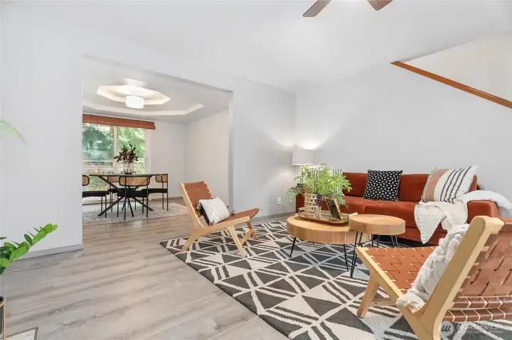 Looking towards the dining rm and backyard. Nice coffered ceilings and new paint throughout