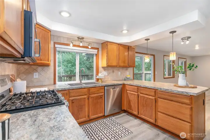 Lots of windows looking out to your private backyard and oversized deck