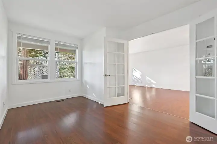 Multi-purpose room with french doors to living room