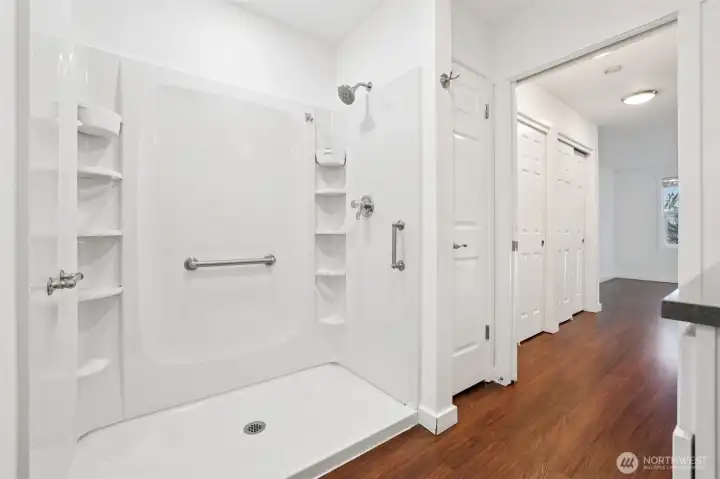 Updated step in shower with handbars and shleves