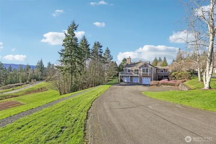 Driveway toward garage door on left
