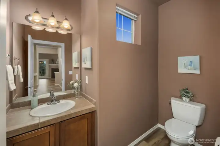 Main level powder room away from main living room-entertaining essential