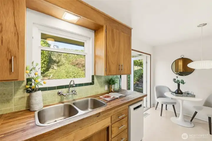 Such a pretty view from the kitchen window.  All windows were replaced in 2024 with Milgard vinyl, double pane.