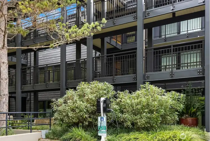 Two EV chargers are located in the parking area of Building 2