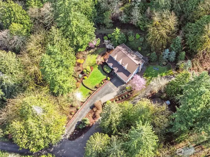 A stunning aerial perspective showcasing the home’s impressive footprint and serene surroundings.