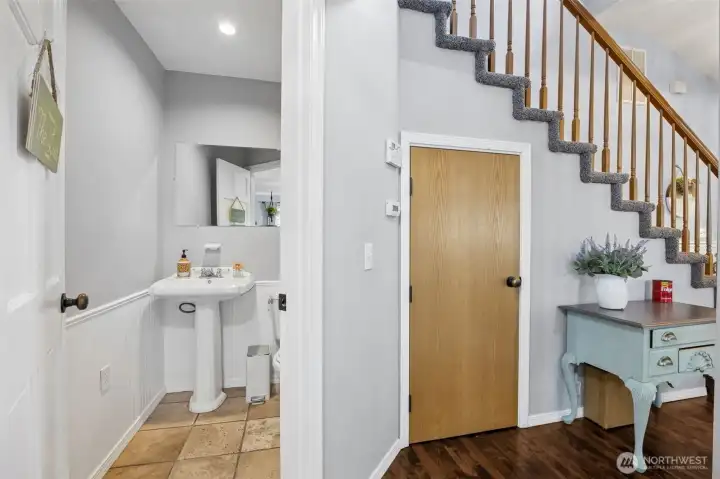 Main-level powder room adds convenience for guests and everyday living.