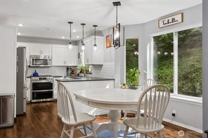 Perfectly centered between the kitchen and living room, the cozy nook is ideal for casual meals or morning coffee.