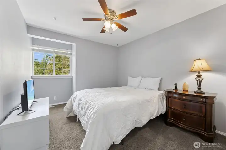 Comfortable and inviting, this bedroom offers privacy and room to make it your own.