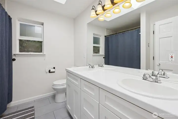 A well-appointed upstairs bathroom offering both style and convenience.