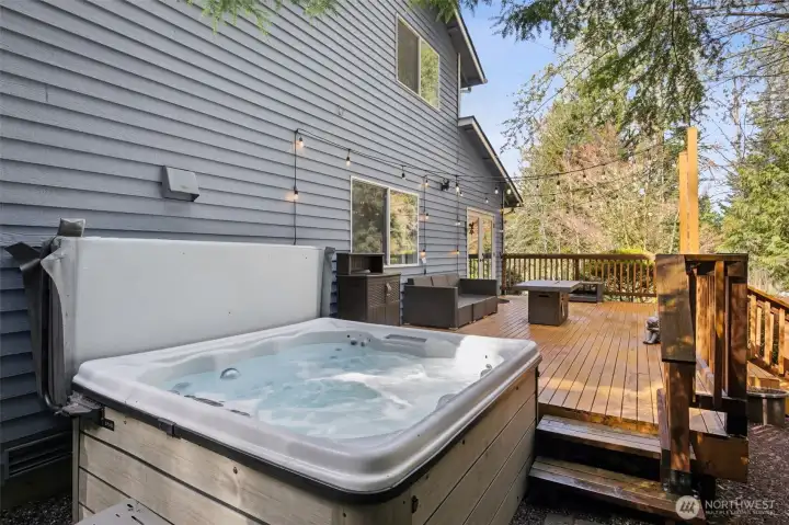 Soak and unwind in the private hot tub while enjoying serene surroundings.