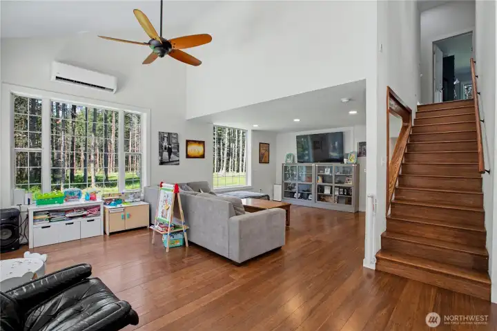 Open concept living with vaulted ceilings.