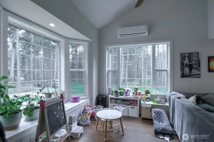 Bay windows to see the woods in the front part of the living room