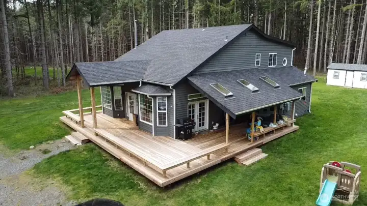 Wide wrap around porch/deck is perfect for BBQs and get togethers