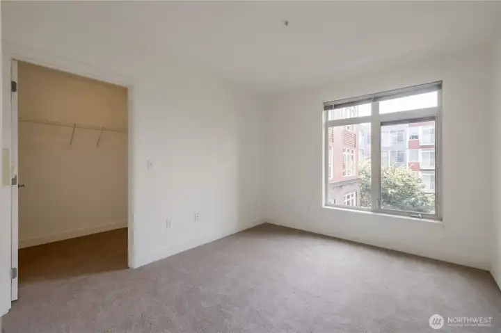 Bedroom with walk-in closet
