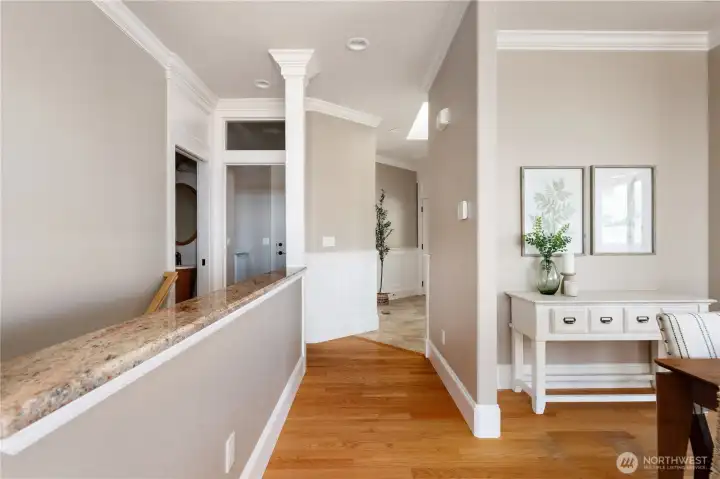 The main floor features a spacious living room, primary suite, kitchen with eating space, dining area, utility room with sink, and a stylish half bath complete with an incredible vanity you won’t want to miss. The utility room leads to the attached 2-car garage with electric car charging and additional storage space
