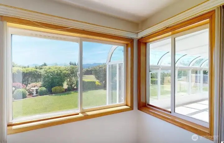 View from the larger 3rd bedroom to both the sunroom and the incredible view.