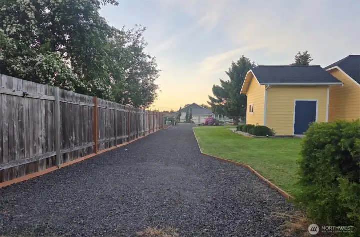 View looking north down the long side driveway allowing for easy access to backyard and ample parking for RV, boat, trailer... all your Pacific Northwest toys!