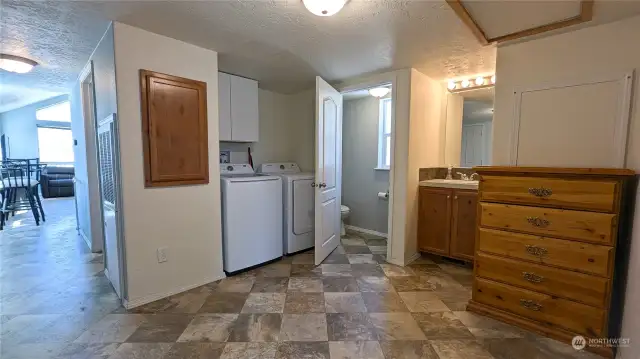 Laundry room with a half bath.