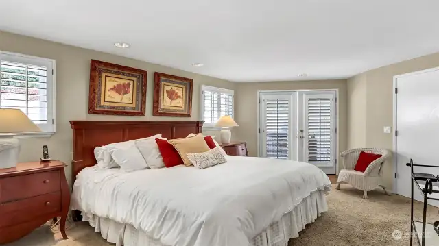 Primary bedroom with king size bed. Off the primary through the French Doors is your private hot tub.