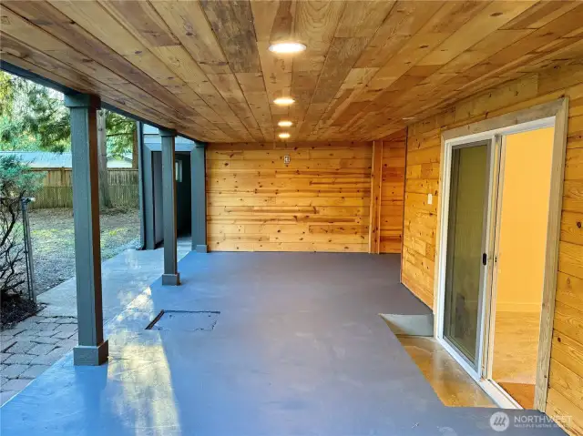 Covered patio -- the sliding glass door leads to primary bedroom.