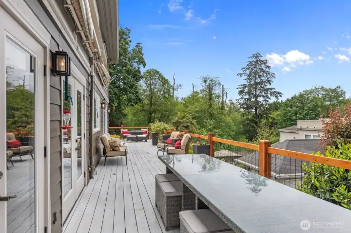 Spacious deck space with access several main-floor areas, including family room.