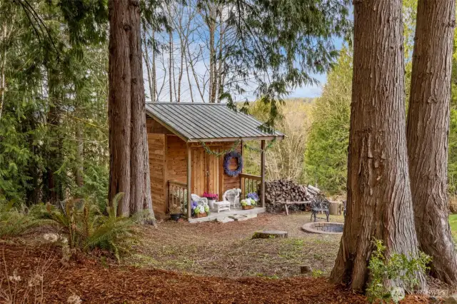 Pathway to a firepit and lounging shed.