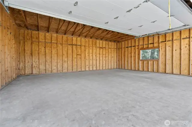 INTERIOR of the Huge 720sqft 3-Car Garage/Shop w/Separate RV Door. Super Clean!