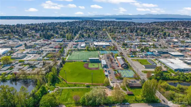 Looking SW over Hicklin Lake, Lakewood King County Disc Golf Club, Evergreen Senior HS and Cascade Middle School and out toward Puget Sound. Centrally located - you'll love living here!