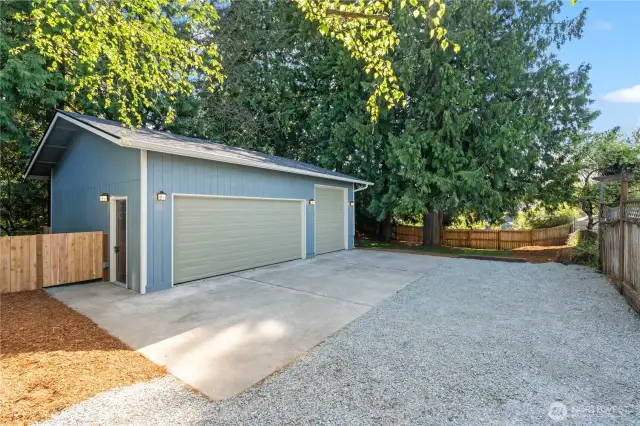 Here's the best part! Huge 720sqft 3-Car Garage/Shop w/Separate RV Door. New Roof, Siding, Doors, Lighting, Gutters. Concrete Parking Pad in front and plenty of gravel driveway for access.