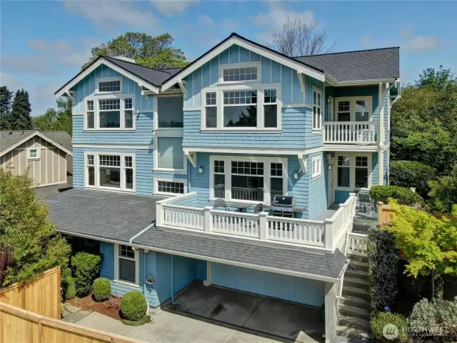 This radiant home is bathed in natural light and offers breathtaking views of Green Lake.
