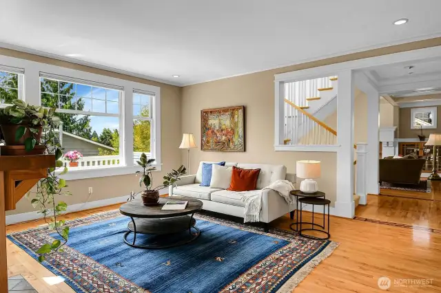 This picture is taken from the deck door- gives you orientation to the family room to staircase and entrance into living room.