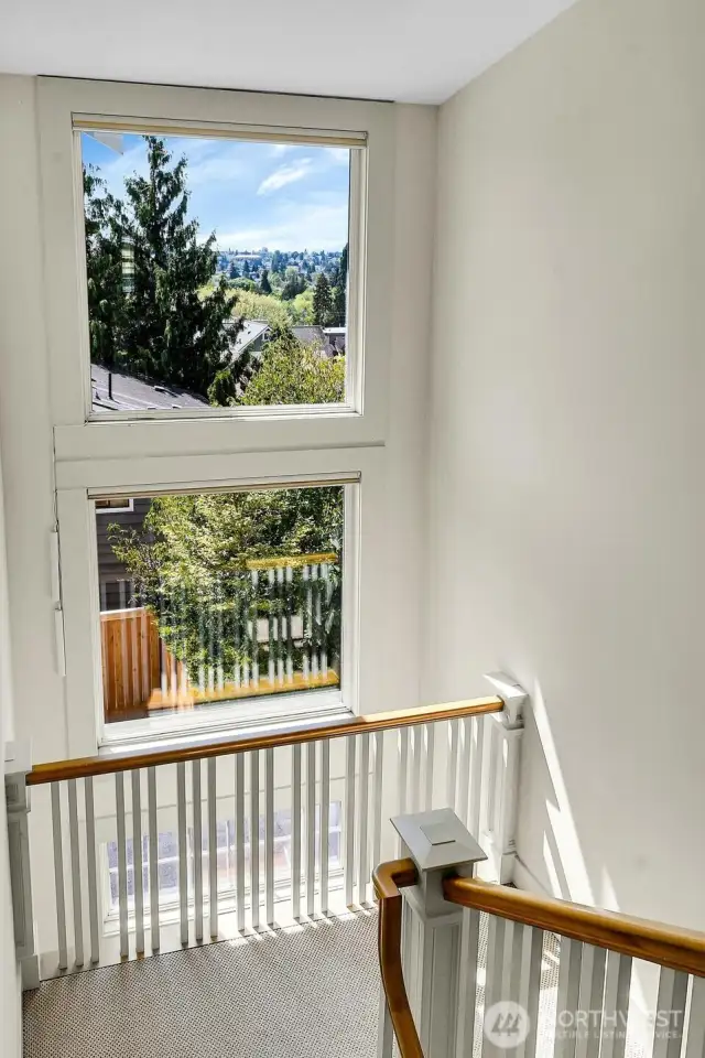 Here are these fabulous picture windows looking south toward the lake. Again- all of this light make this home light and airy.