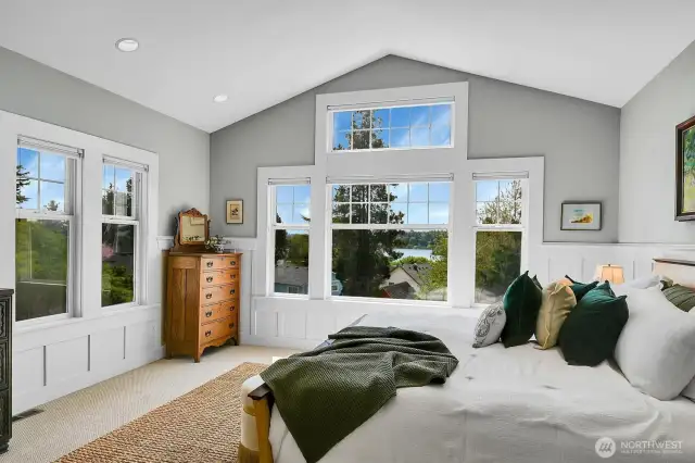 The primary suite feels like a dreamy spa- quiet and serene. These large picture windows are looking south to Green Lake. Such a treat!